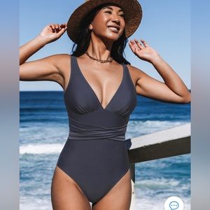 New one piece suit in package